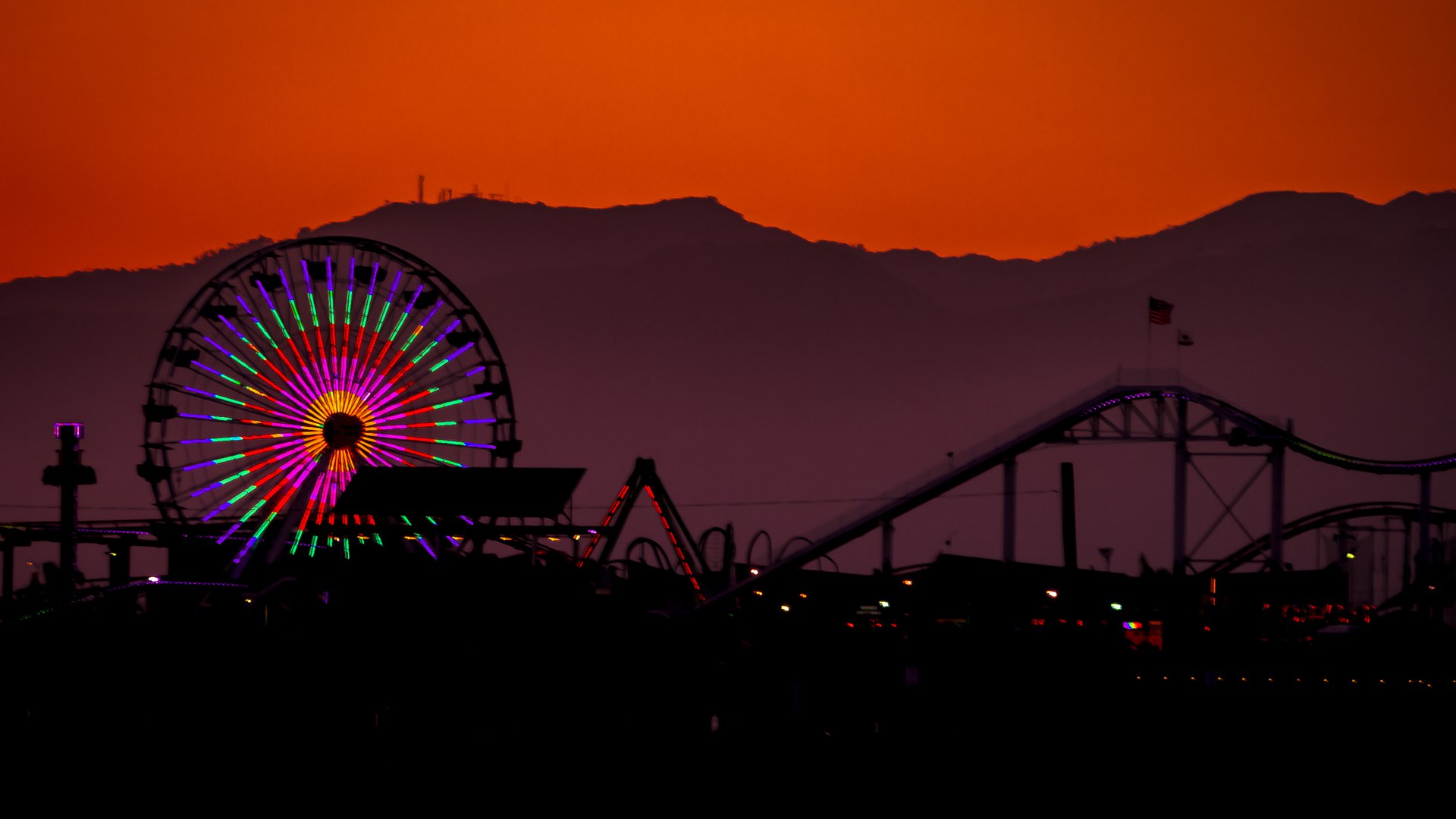 The Pacific Park Ferris wheel on the Santa Monica Pier at sunset