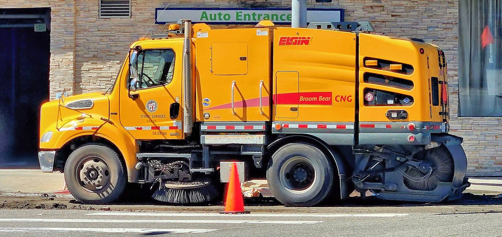 A City of Los Angeles Department of Public Works street sweeper working a residential curb lane in the Sawtelle neighborhood.