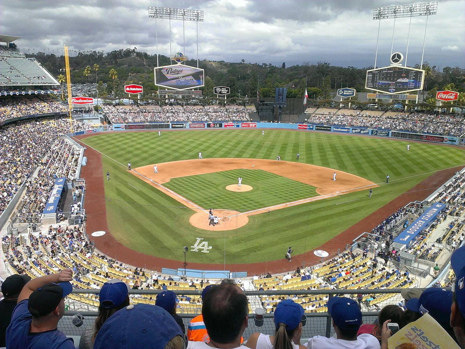 Dodger Stadium seen from the upper deck during a game, with the infield and a full crowd