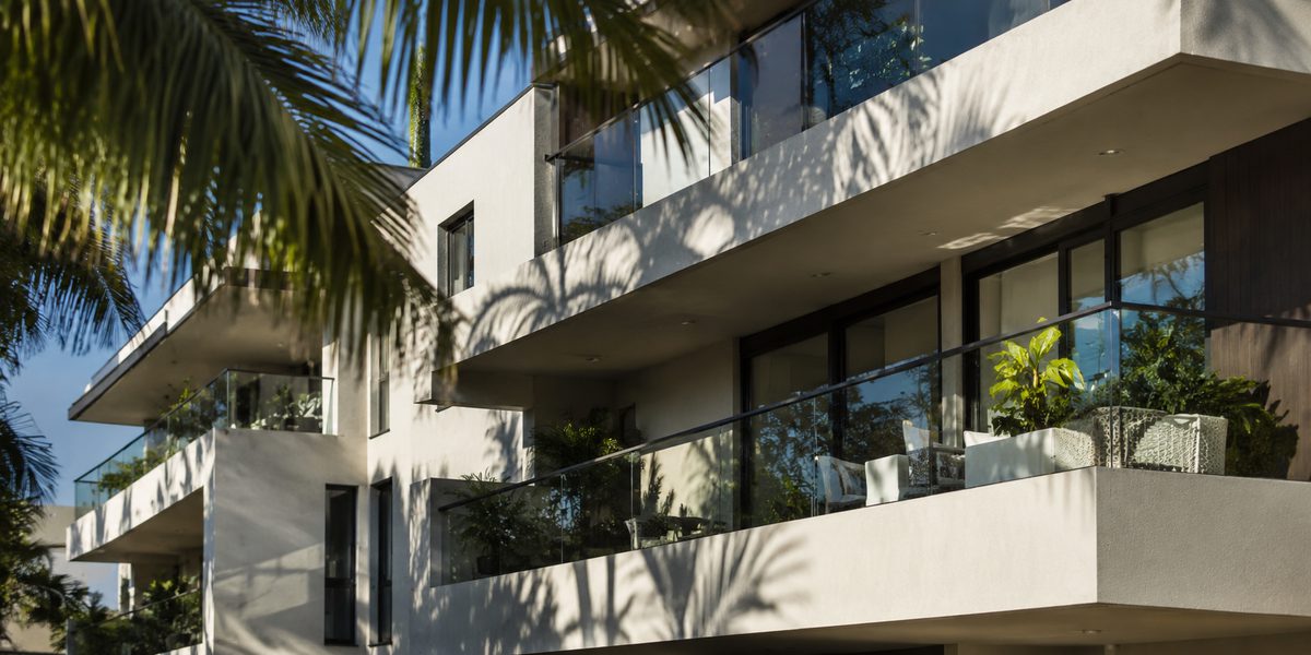 A modern apartment building with wide balconies
