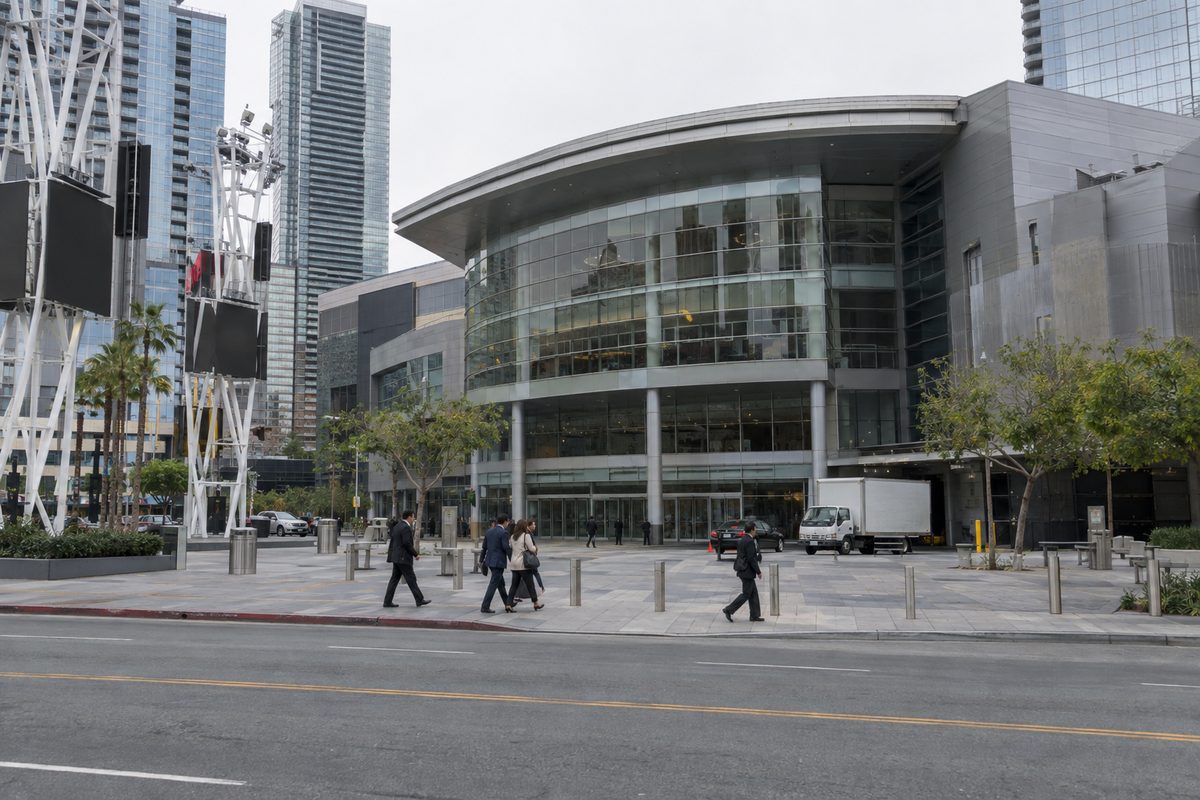 The theater at the L.A. Live complex in downtown Los Angeles on an overcast afternoon, people crossing the plaza in front.