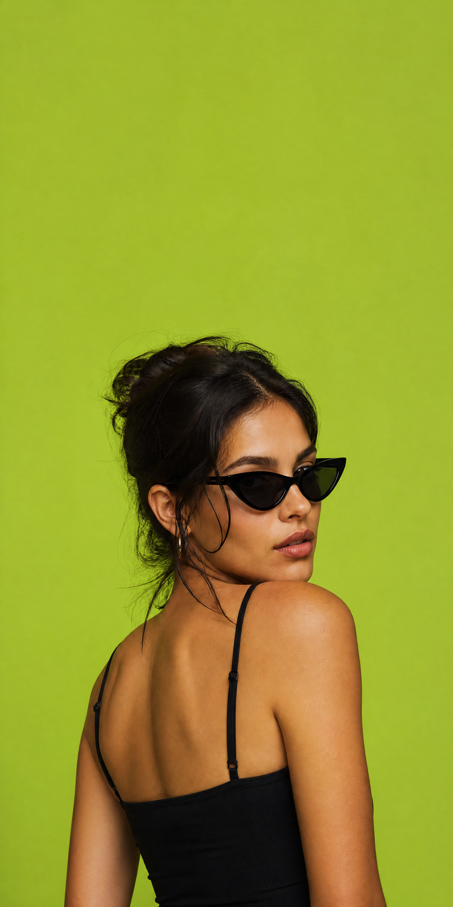 Woman in sunglasses wearing a black going-out top