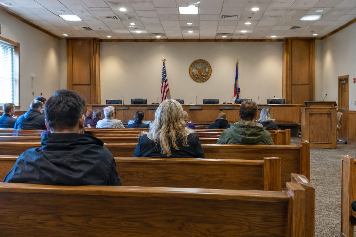 A public hearing room in a county government building before a meeting.