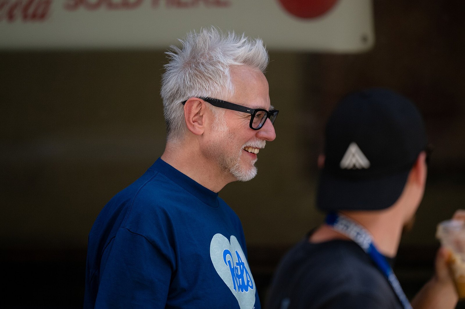 James Gunn looking at something during Superman 2025 filming.