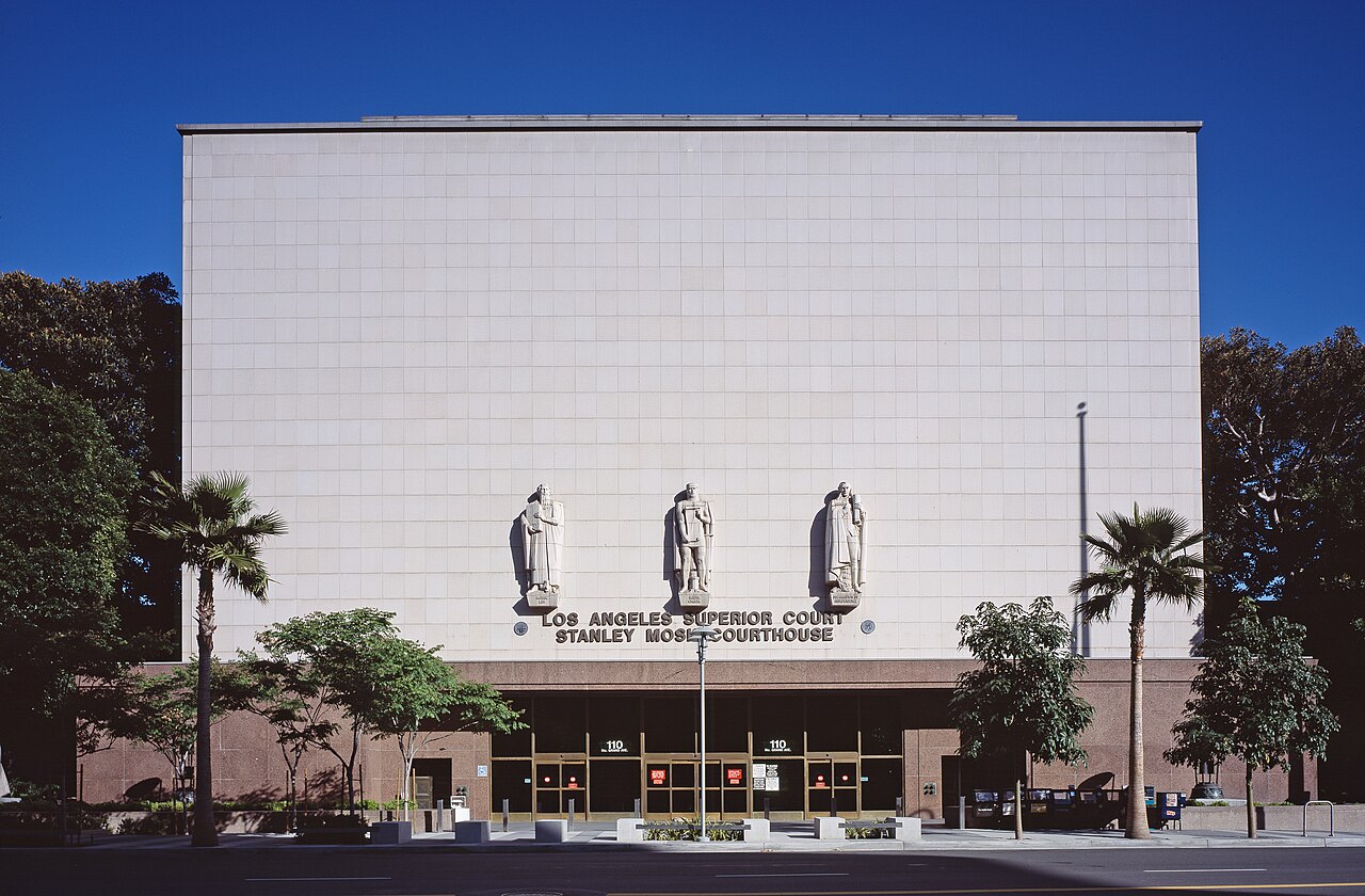 The Grand Avenue entrance facade of the Stanley Mosk Courthouse in downtown Los Angeles, with bas-relief statues above the doors