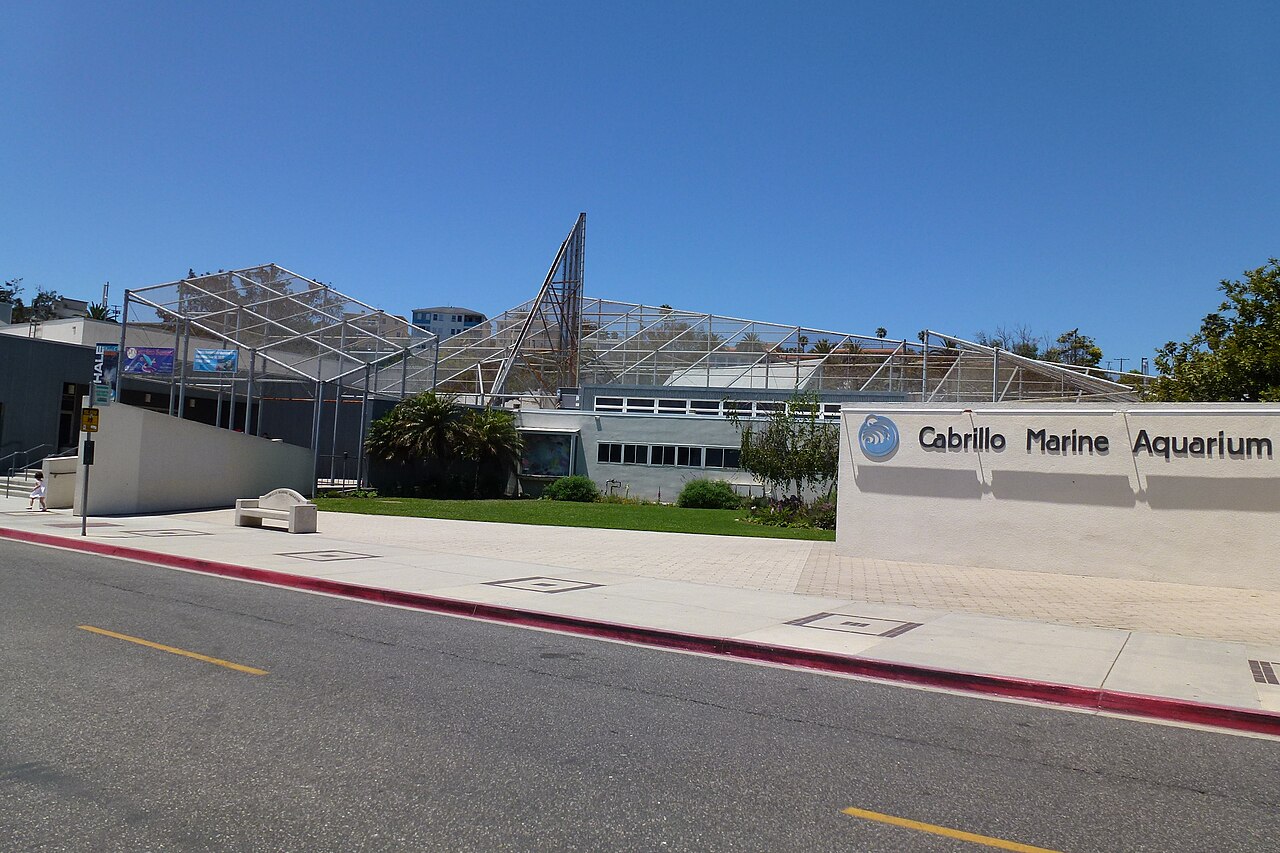 The chain-link frames and entrance sign of Cabrillo Marine Aquarium in San Pedro