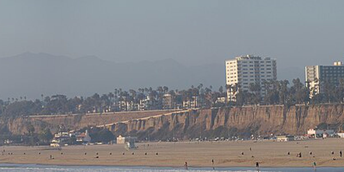 Santa Monica seen from the coast, with the pier and the city behind it