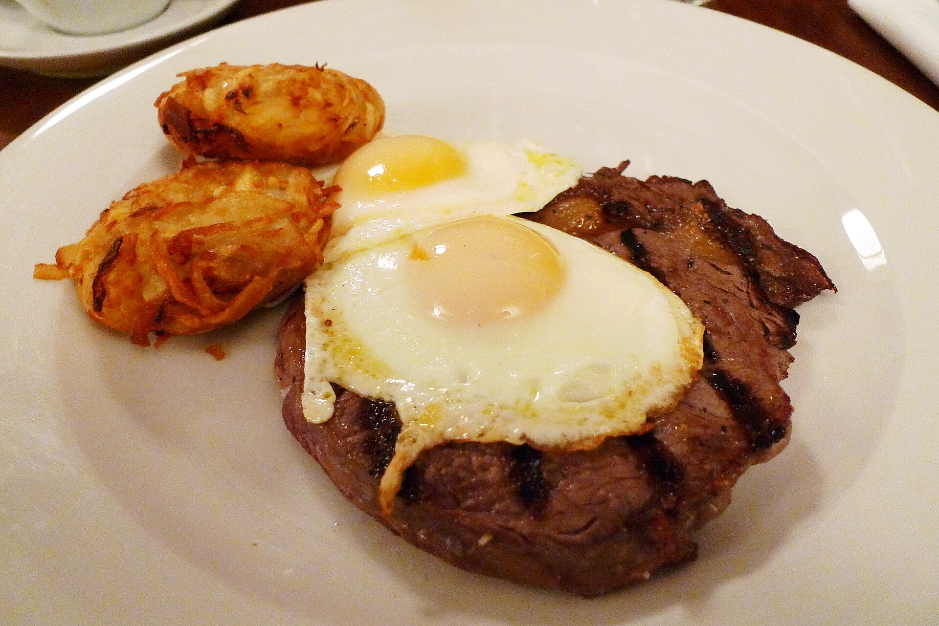 A grilled steak plated at a steakhouse