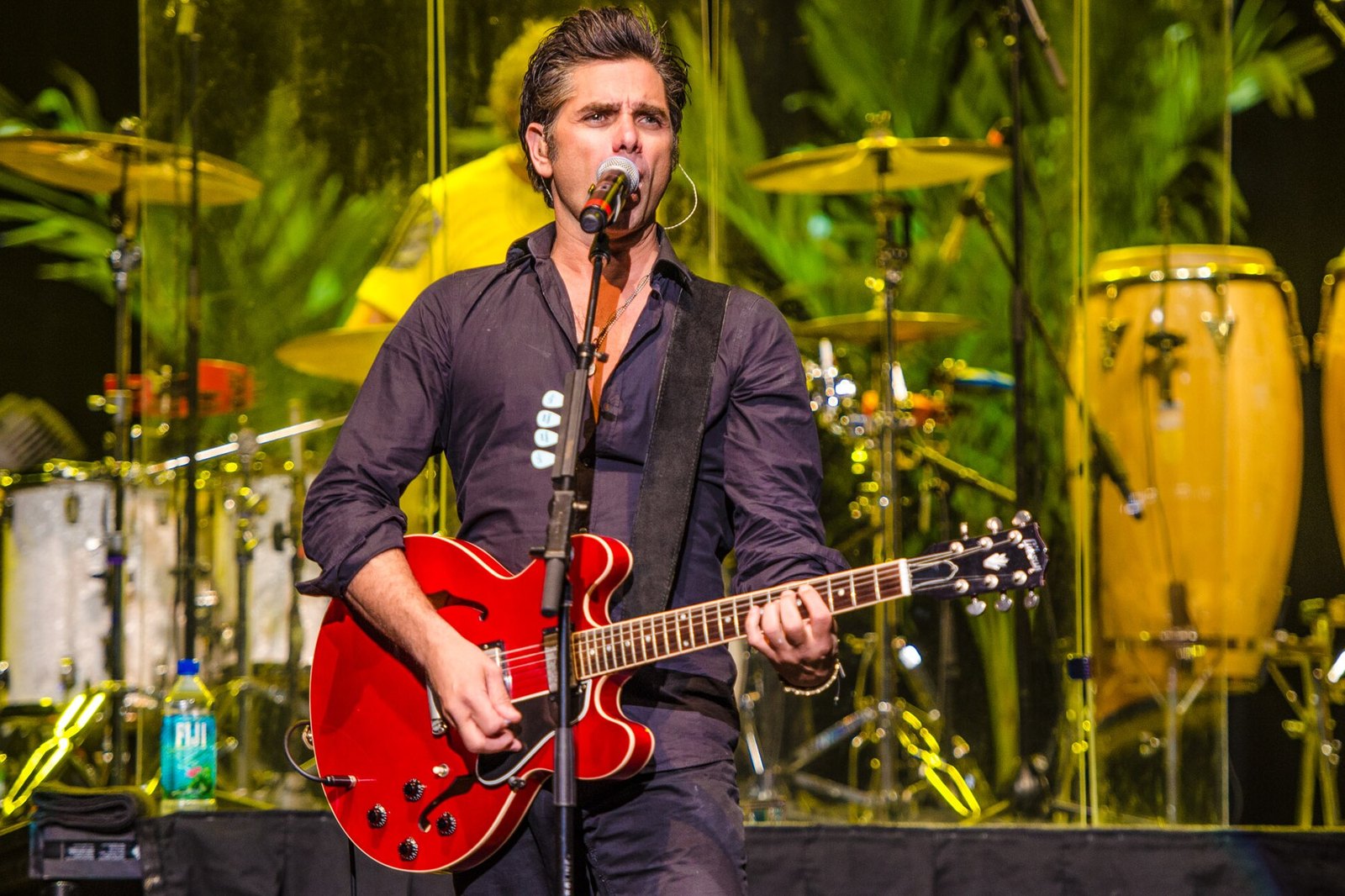 John Stamos playing the guitar for the Beach Boys at Neal S. Blaisdell Center, Honolulu, Hawaii, January 12, 2014.